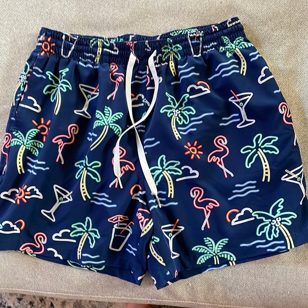 Chubbies men’s swim trunks. Navy with flamingos and palm tree design